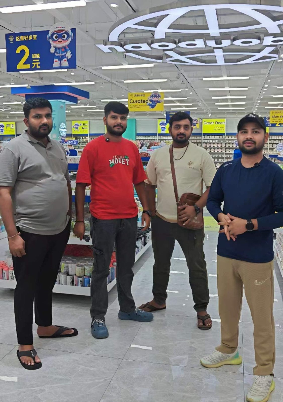 AwwwStore store owners celebrating at a real supplied dollar store